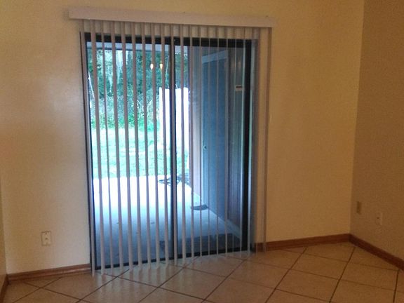 Living room area with view of covered patio