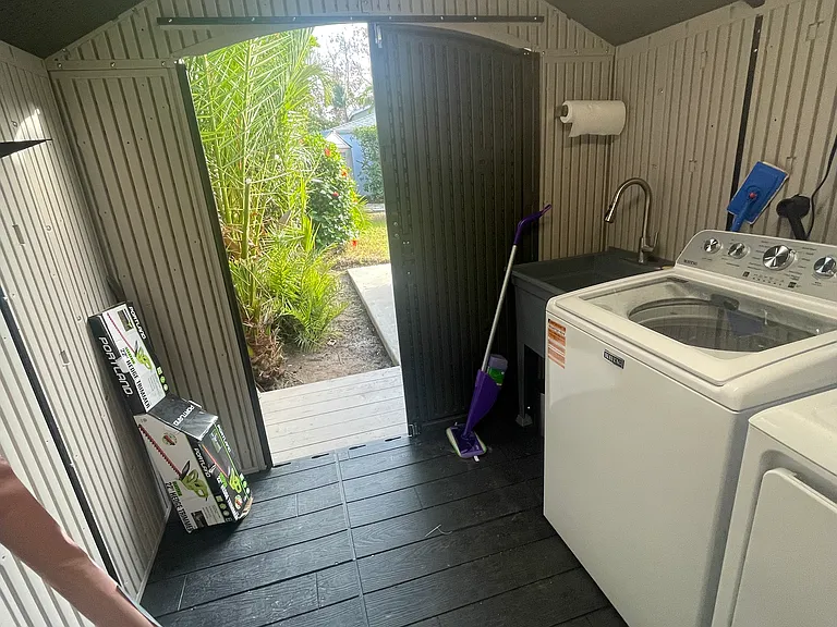 Shed for laundry. Lighting for night time.