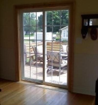 Patio doors lead to deck from kitchen