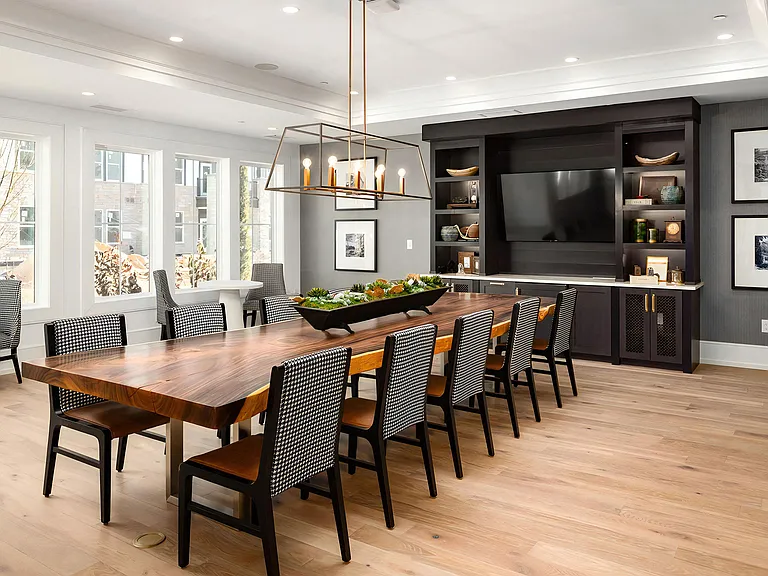Conference Room with Natural Wood Table and Statement Lighting