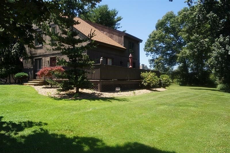 Large wrap around front/side porch with mature landscaping. This is such a relaxing place to hang out.