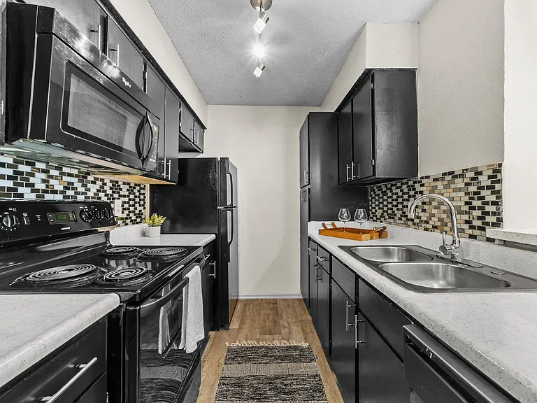 B1 Kitchen w/ Black Appliance Package & Tile Backsplash