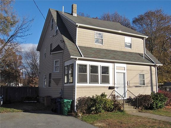 Enclosed Front Porch with New Windows and Paved Driveway!