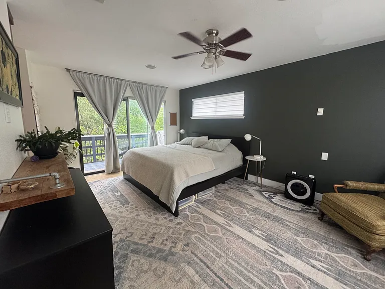 master bedroom with balcony