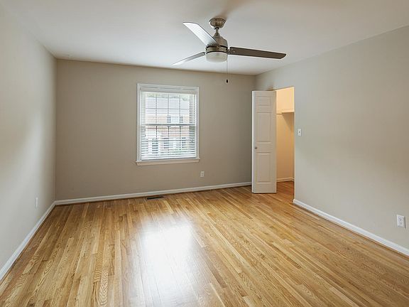 Master bedroom with ceiling fan and two closets!