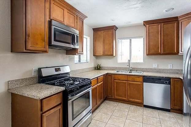 Eat-in kitchen with granite counters and stainless steel appliances included. New microwave.