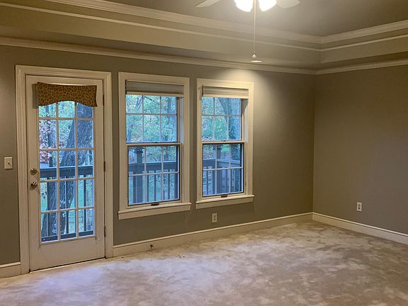 master bedroom with coffered ceiling