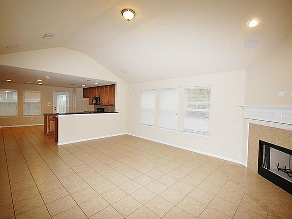 Living room ties in very nicely with the kitchen.