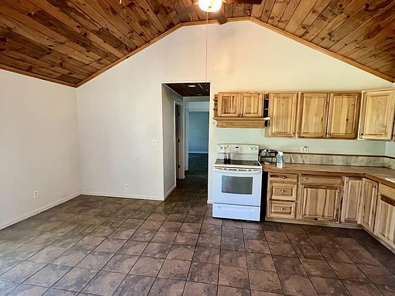 entry through french doors into kitchen living area.