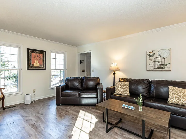 Double cellular shades are to be installed on these living room windows and the rest prior to rental availability