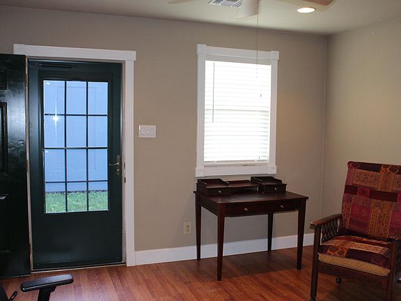 Living Room with insulated exterior door & storm door