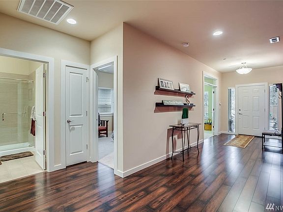 Looking back toward the entry you get a peek-a-boo view of the office, 1st guestroom and main bath. The home is also equipped with a security and fire sprinkler system.