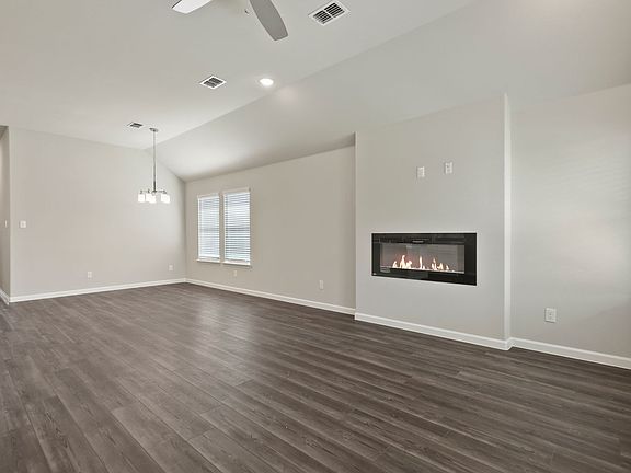 Living room in the Quartz home plan by Trophy Signature Homes - REPRESENTATIVE PHOTO