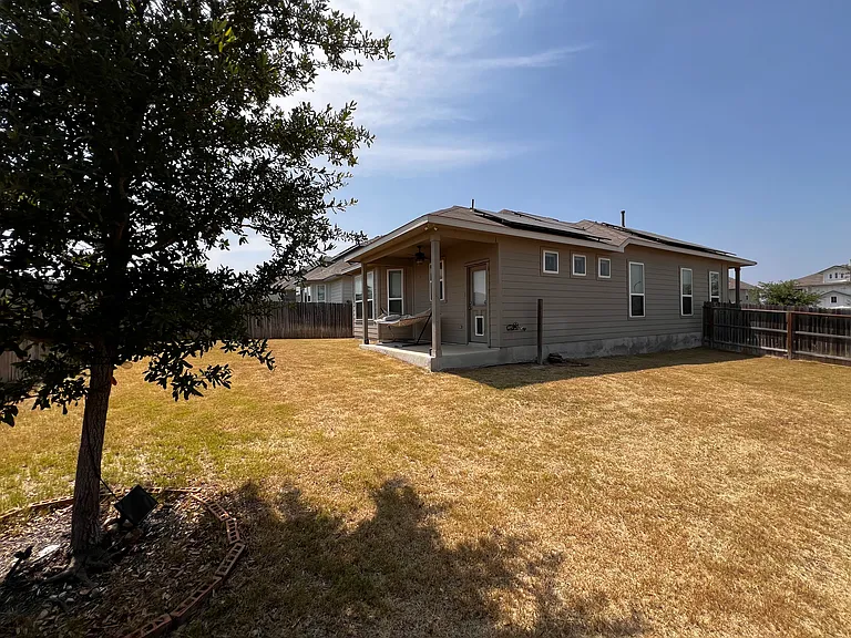 Backyard wide shot, plenty of yard space
