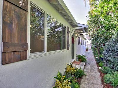 The back patio gate opens to the front sidewalk. 1757 is nearest door.