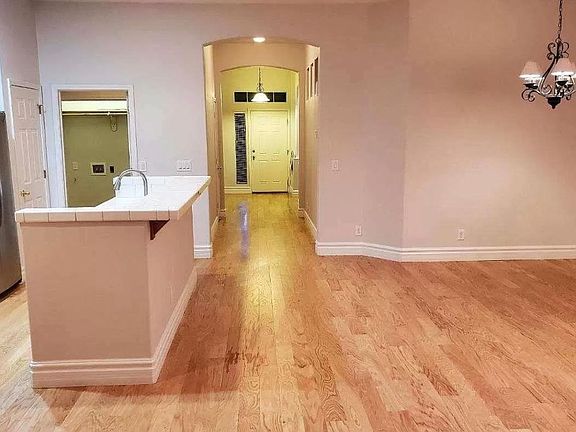 Picture taken from back of house facing front door at the end of the hallway