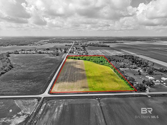 Birds eye view of property featuring a rural view