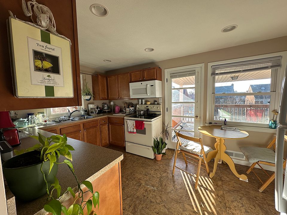 Self cleaning glass top range and over counter microwave. Covered porch accessible from the kitchen.
