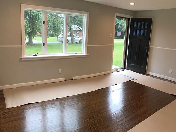Living room (floors covered after refinishing)