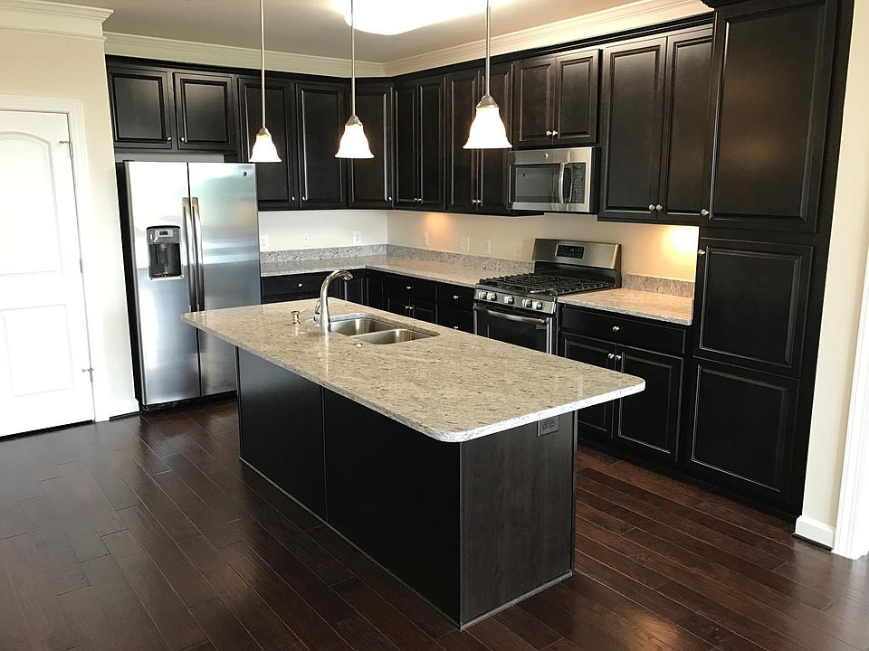Spacious kitchen island with stainless steel appliances