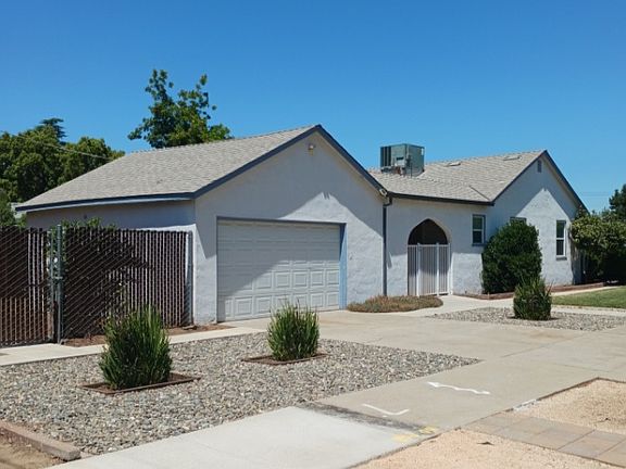 Side view of house with 2 car garage.
