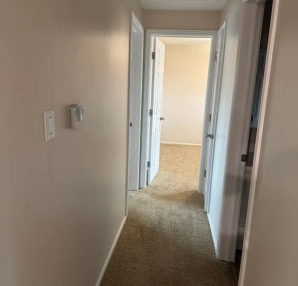 Hall to 3 bedrooms and bathroom