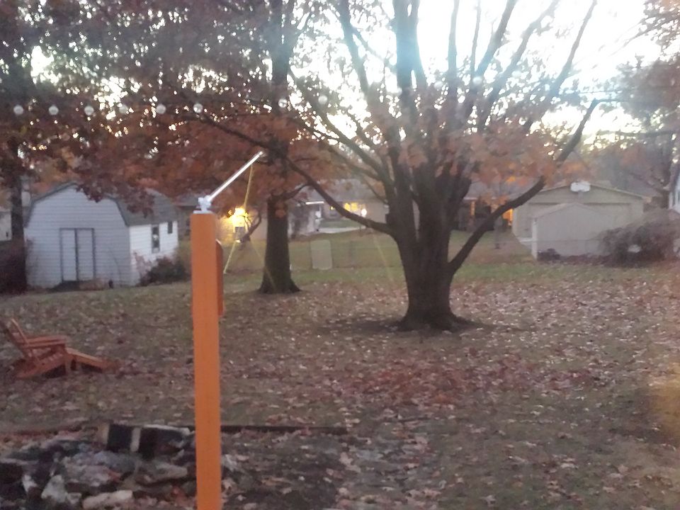fenced backyard with shed
