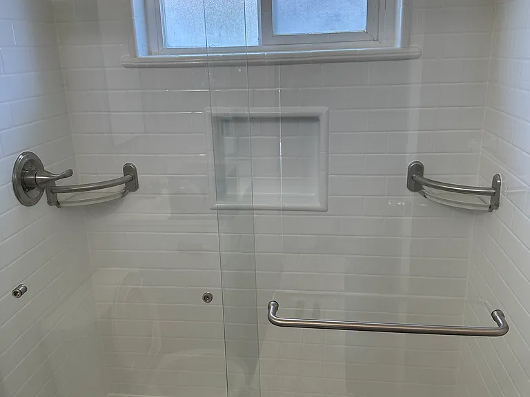 The bathroom has a new extra large shower, brushed nickel sliding door & fixtures (no tub), and all new vanity, cabinets, and toilet.
