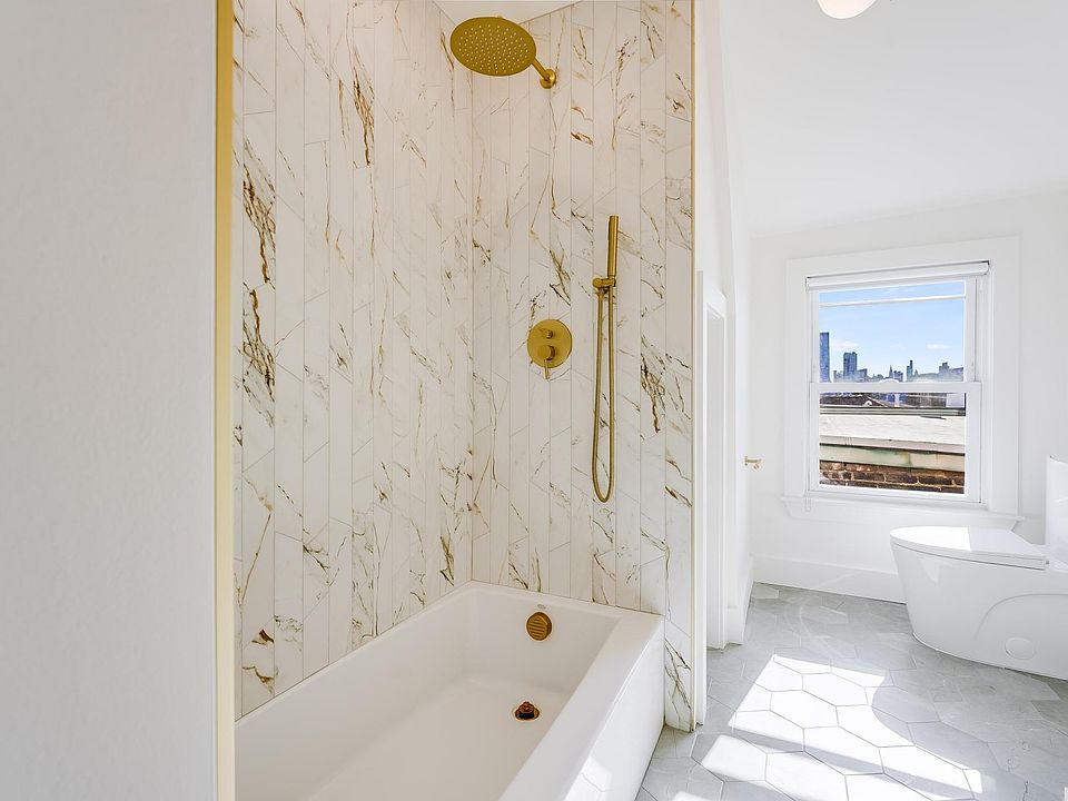Bathroom with unobstructed Manhattan view