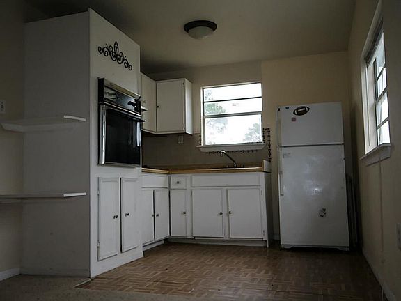 Kitchen with 2 windows allowing for Natural Lighting.