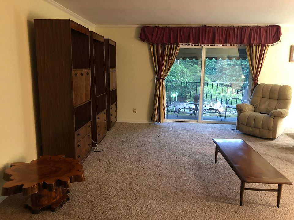Living Room with three shelving units.