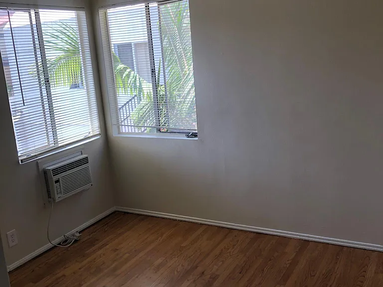 Bedroom with Air Conditioner and Ceiling Fan.