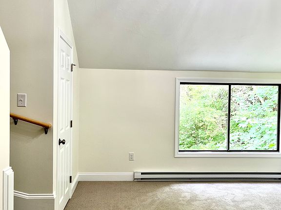 Bright and Sunny LARGE Main Bedroom with Vaulted Ceilings, Chandelier, and Staircase to Loft.