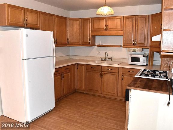 Kitchen with new floors, newer appliances