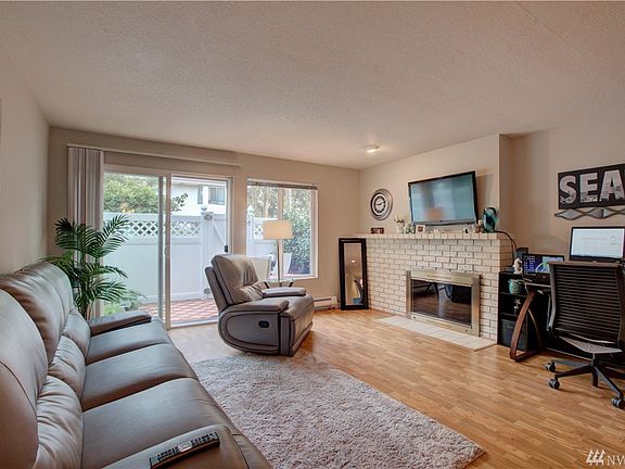 Large open living room with access to outdoor patio area. 