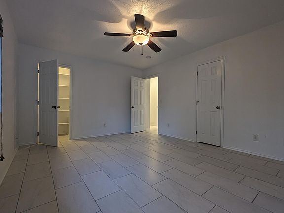 Large master bedroom with walk in closet, and additional storage closet.