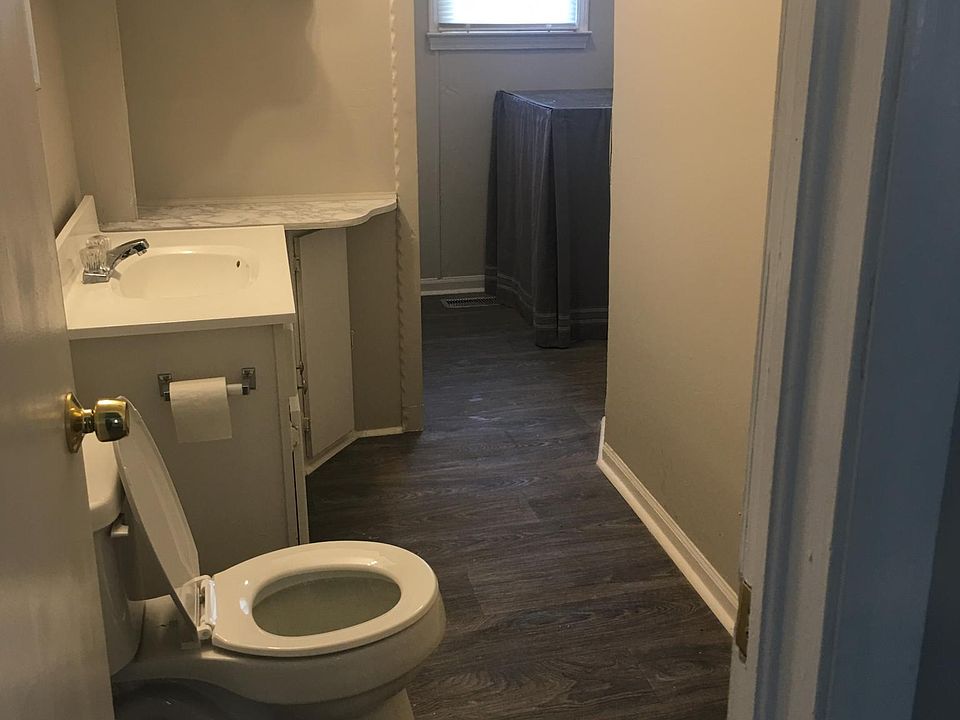 Bath with shower enclosure