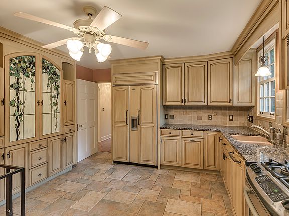 Updated kitchen with granite counters and gas range.