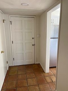 To the left is a large pantry; To the right is the kitchen