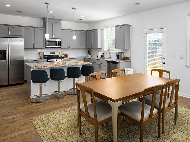 Spacious kitchen with an island, ample storage, and stainless steel appliances.
