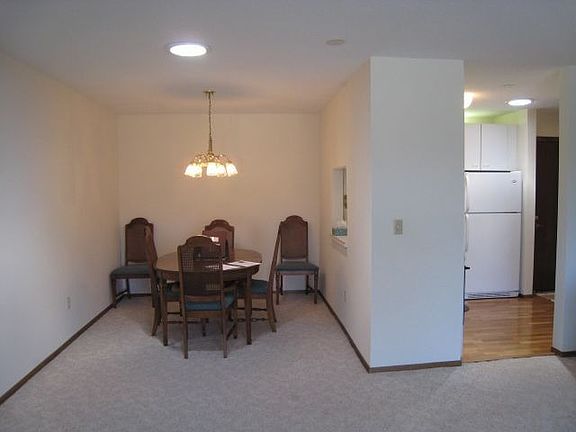 Dining room.  Note solar tube above in foreground and in kitchen.