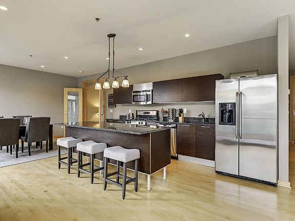 OWNER ADDED GRANITE ISLAND & CUSTOM BLIND & LIGHT FIXTURES!