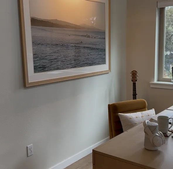 Executive desk & surfing art in living room