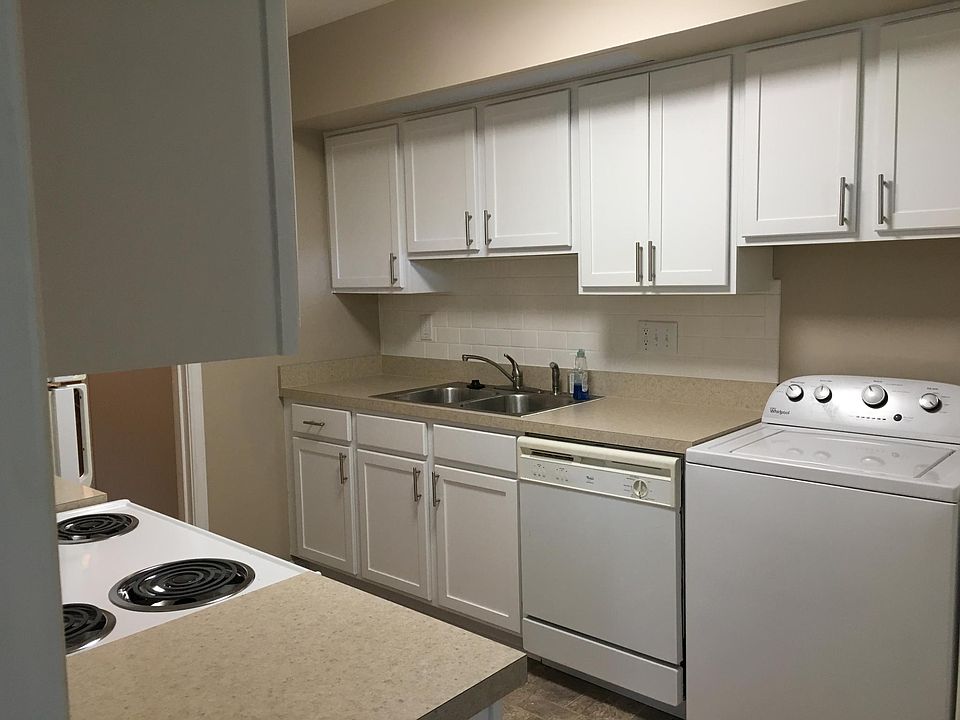 New shaker style cabinets, new countertop, new sink, new disposal, and new microwave.