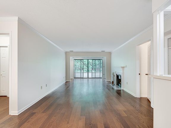 View from entry door. Spacious living room flanked by two bedrooms and baths.