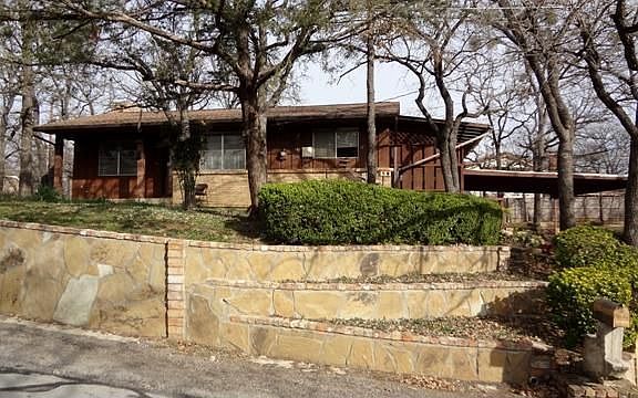 Front of home with flagstone terrace work