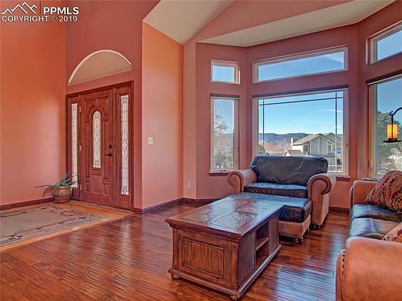 The gorgeous living room has an expansive view of the mountains.