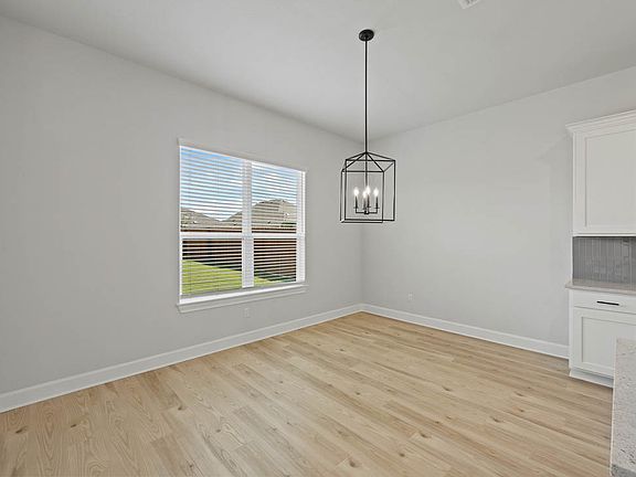 The dining room sits right off of the kitchen.