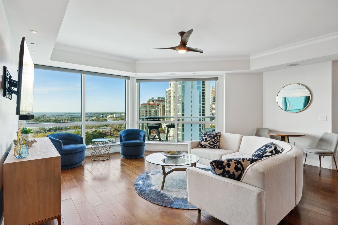 Living room/dining room/ kitchen with sweeping water views