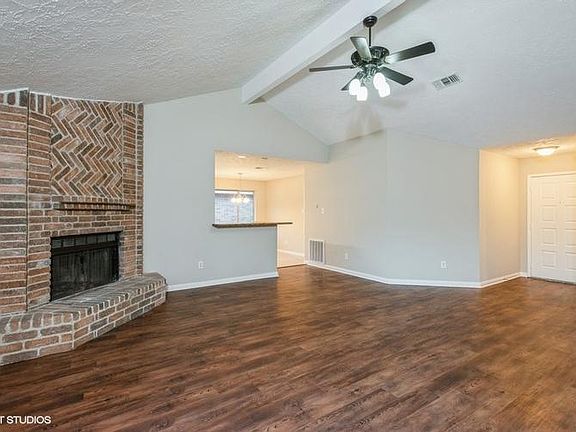 Another view of the den without virtual staging.